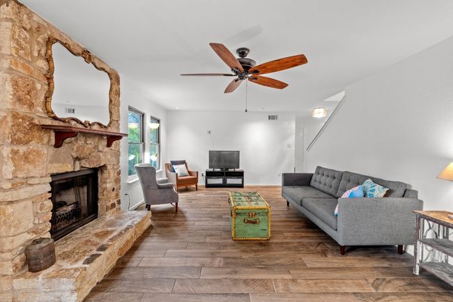 Cozy up with a book, gather for game night, or just enjoy the glow—the fireplace isn’t just a feature, it’s a natural gathering spot that adds warmth and meaning to everyday moments | Image 5