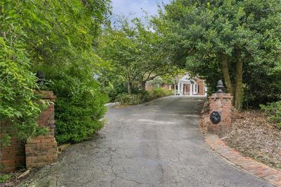 Stately entrance with custom insignias | Image 3