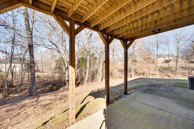 Grab a book and enjoy the shaded patio off of the basement kitchen. | Image 44