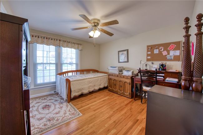 Bedroom with lots of space and hardwood flooring | Image 24