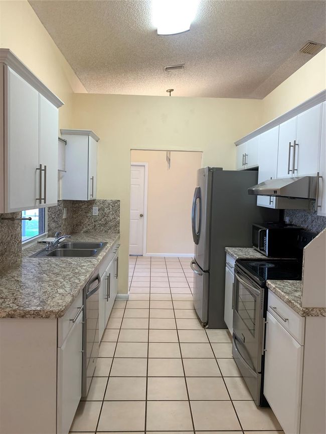 9840 Nw 28 Th Ct, House other with 4 bedrooms, 2 bathrooms and null parking in Coral Springs FL | Image 18