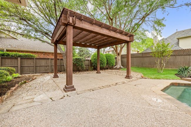 View of patio featuring a fenced backyard and a pergola | Image 33