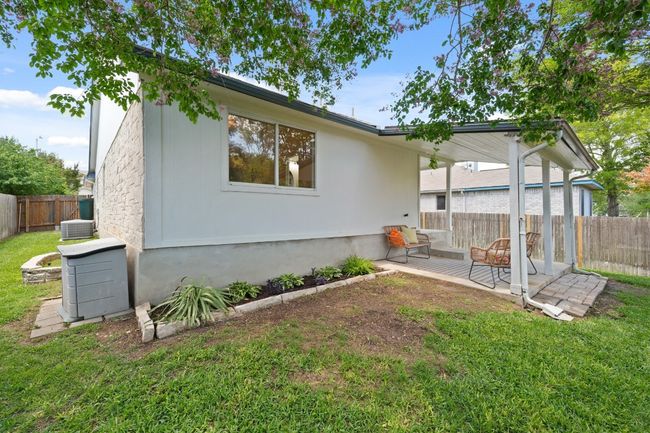 Side yard has a vegetable bed | Image 26
