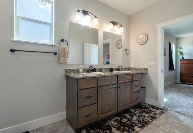 Full bath with double vanity and tile patterned floors | Image 15