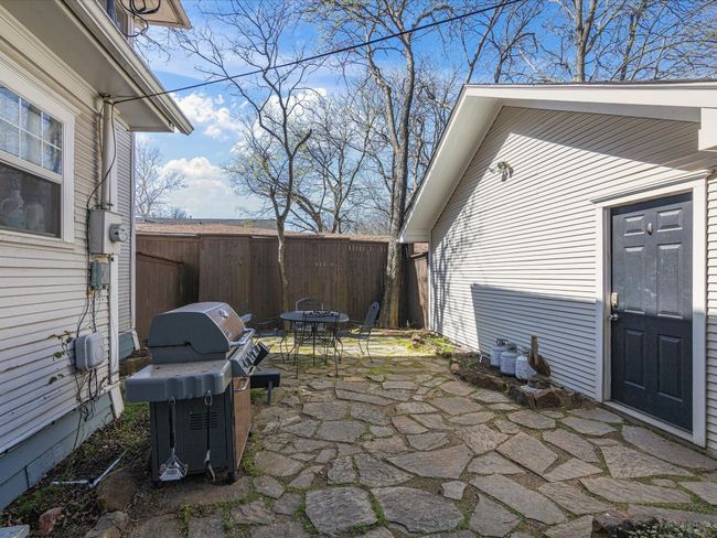 Fire up the grill or boil pot and enjoy shaded seating in this flagstone patio area. Talk about peaceful living! | Image 33