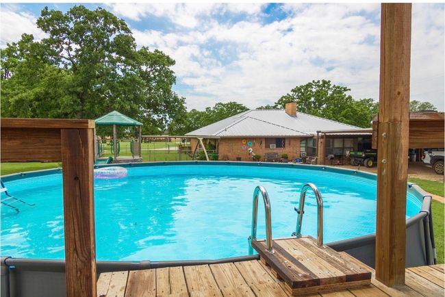 View of outdoor pool | Image 12