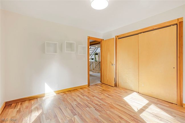 Unfurnished bedroom featuring light wood finished floors and a closet | Image 26