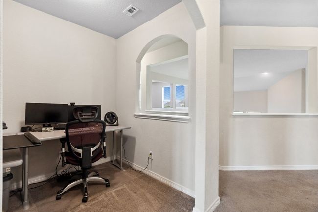 The upstairs study nook offers the perfect quiet retreat for reading, studying, or catching up on work | Image 25