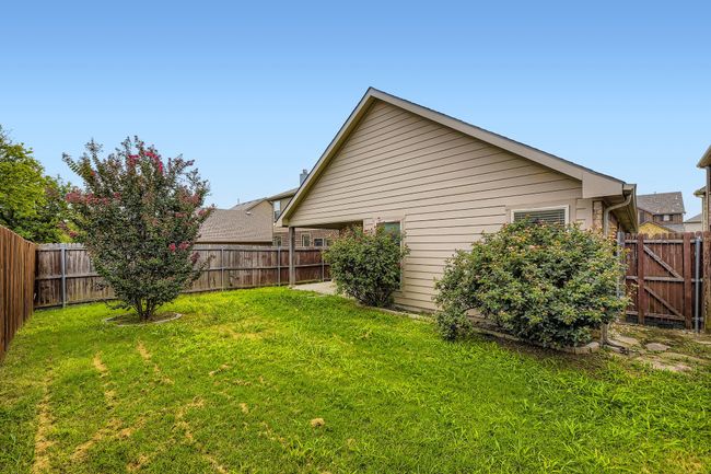 View of fenced backyard | Image 28