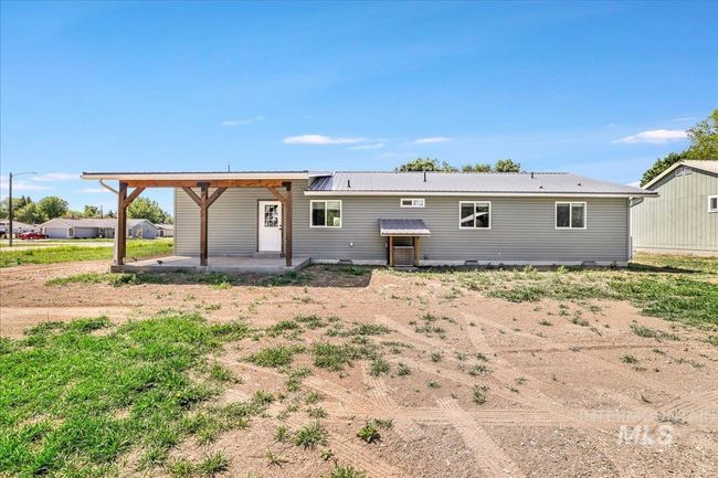 Back of property with a patio and a metal roof | Image 30
