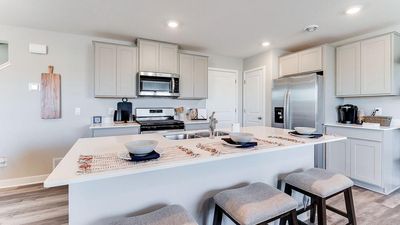 Another view of the Kitchen. Photo of model home, color & options will vary. | Image 3