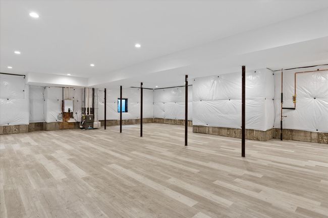 Basement with light wood-type flooring | Image 19