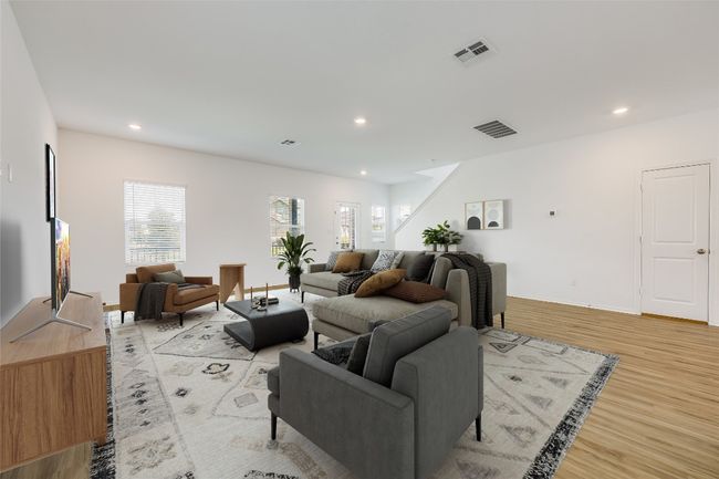 Living room featuring light wood-type flooring and recessed lighting | Image 5