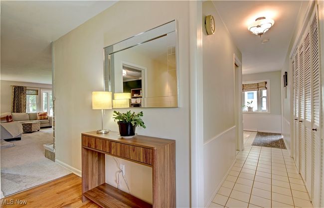 Corridor featuring healthy amount of natural light and light wood finished floors | Image 5