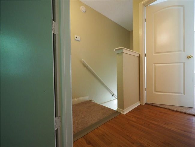 Stairway with wood finished floors and baseboards | Image 11