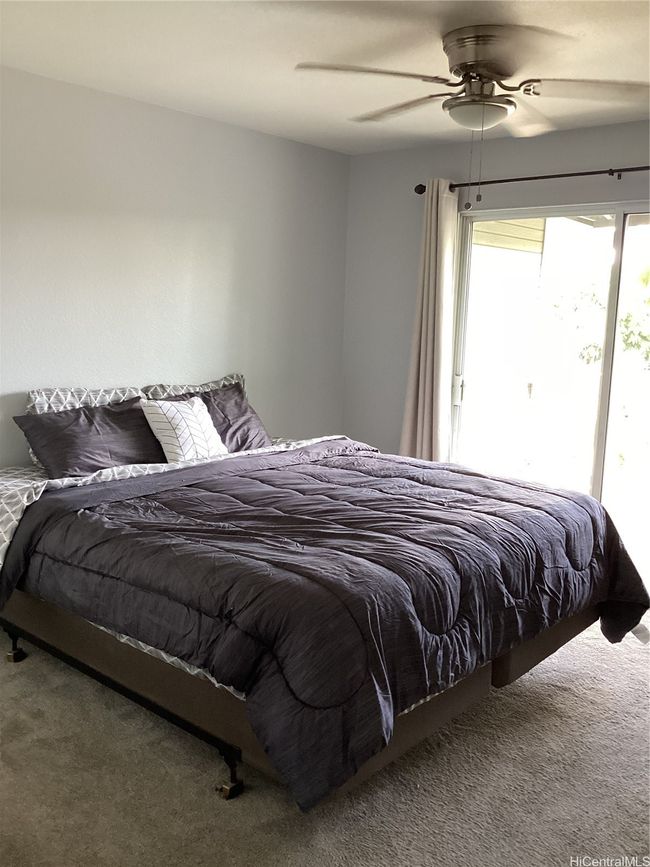 Primary bedroom with ceiling fan for comfort | Image 9