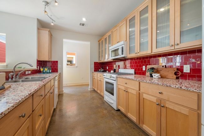 Appliances include a gas range, built-in microwave, and dishwasher | Image 13