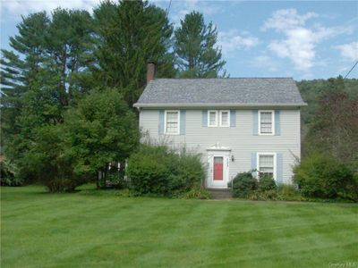 Colonial home featuring a front yard | Image 1