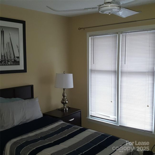 2nd Bedroom with Queen Bed. Of note, ceiling fan and huge wall closet. | Image 19