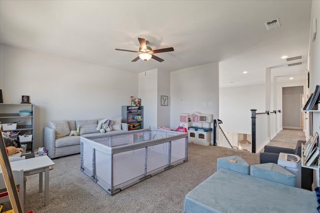 Living room featuring light colored carpet, ceiling fan, and recessed lighting | Image 28
