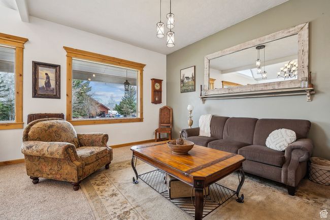 Living room featuring baseboards and carpet floors | Image 9