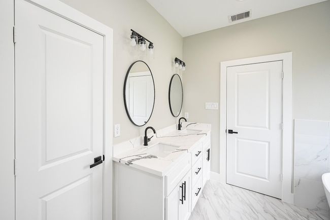 Double Mirrors Above The Bathroom Counter With Double Sinks & With Spacious Cabinet Space Underneath To Tuck Away Your Toiletries | Image 25