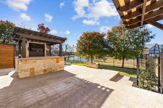 View of patio / terrace featuring a water view and a pergola | Image 25