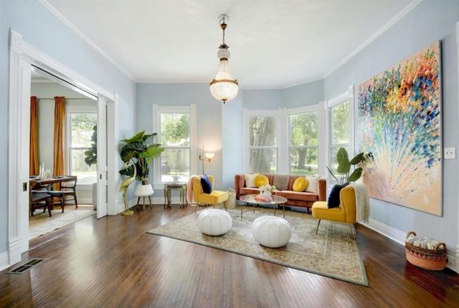 Living room featuring wood-type flooring and crown molding | Image 6