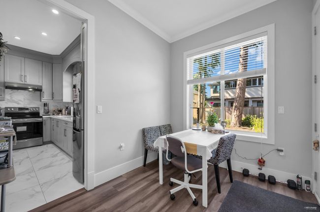 Dining room with crown molding and recessed lighting | Image 16