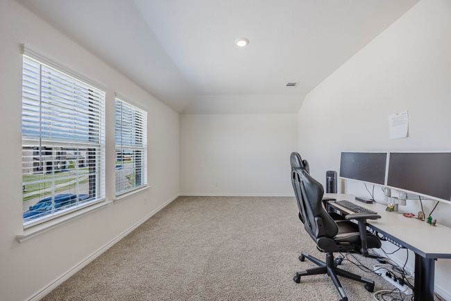 Carpeted office space with baseboards and vaulted ceiling | Image 21