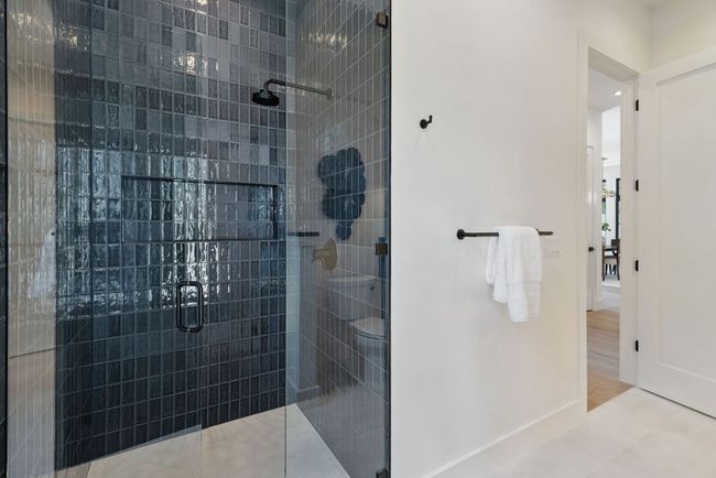 Full bath featuring a stall shower and baseboards | Image 18