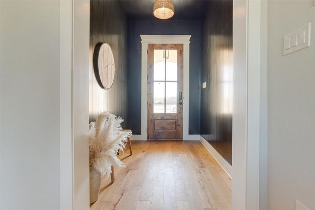 Doorway to outside with light wood-type flooring | Image 5