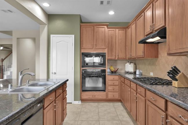 Plenty of cabinets and drawers for storage. | Image 13