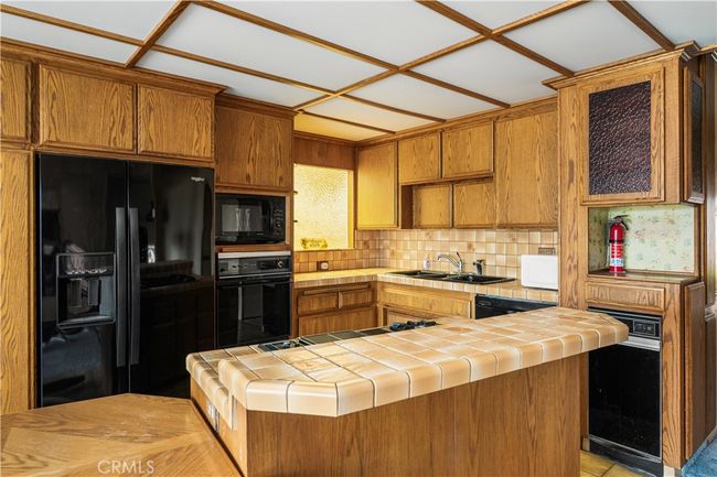 Spacious Kitchen with Built-In Dining & Storage | Image 26