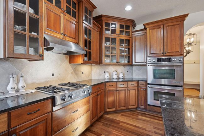 Powder room, mudroom and laundry room are down the hall to the right. | Image 24