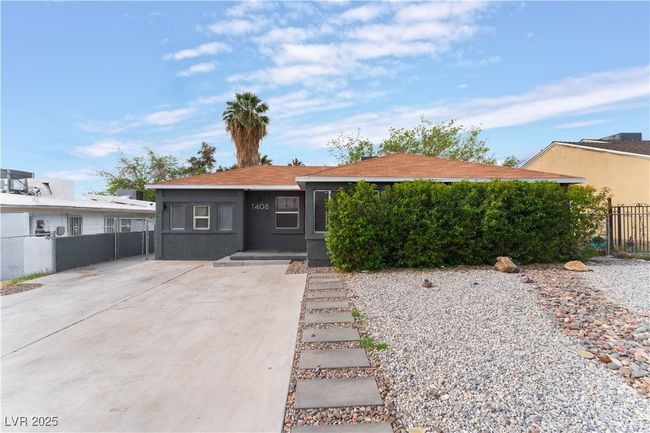 View of front of house with a gate and fence | Image 8