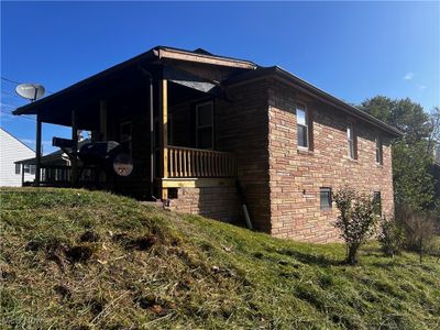 View of property exterior featuring covered porch | Image 2