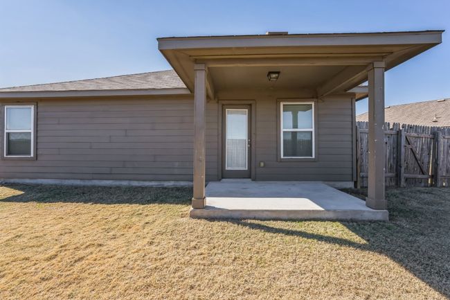 Property entrance with a patio area and a lawn | Image 21