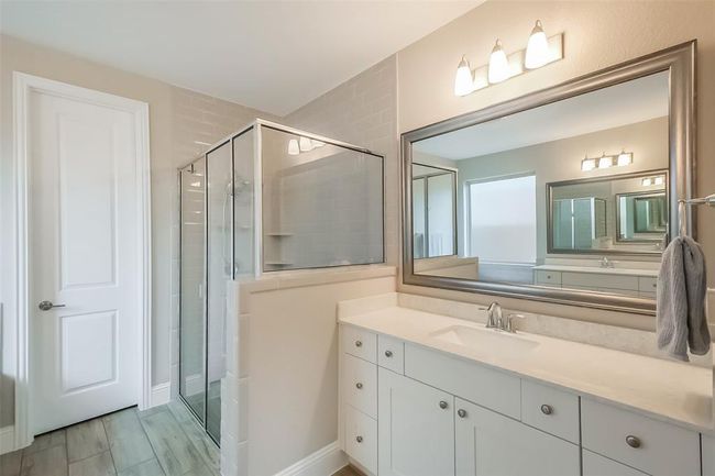 View of the large walk in shower. | Image 9