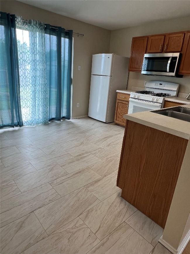 Kitchen with new tile flooring | Image 10