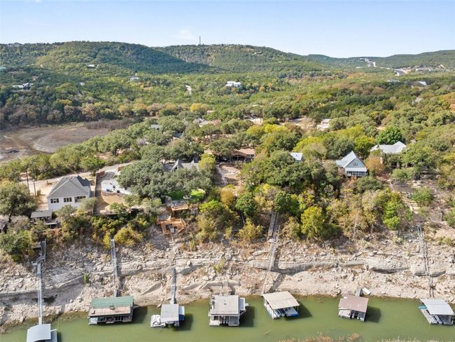 Aerial view of the boat slip and back of the​​‌​​​​‌​​‌‌​‌‌​​​‌‌​​‌‌​‌​​​​​‌ house. | Image 15