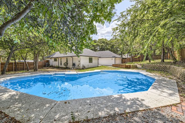 View of pool with a fenced in pool and a fenced backyard | Image 26