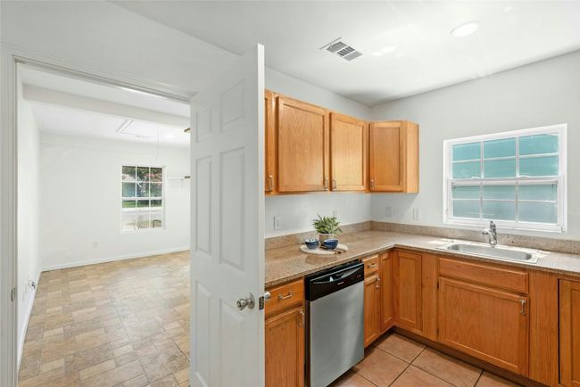 Bedroom with laundry off kitchen | Image 9