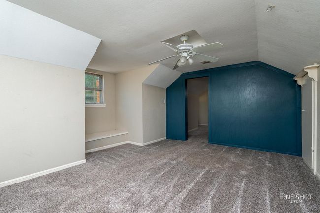 Bonus room with ceiling fan, carpet flooring, a textured ceiling, and vaulted ceiling | Image 26