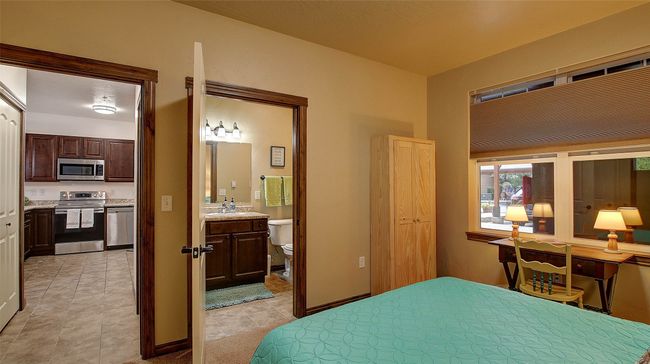 Guest Bedroom with direct access to the second bathroom, carpeted, neutral tones. Top down bottom up shades for privacy. Spacious closet. | Image 25