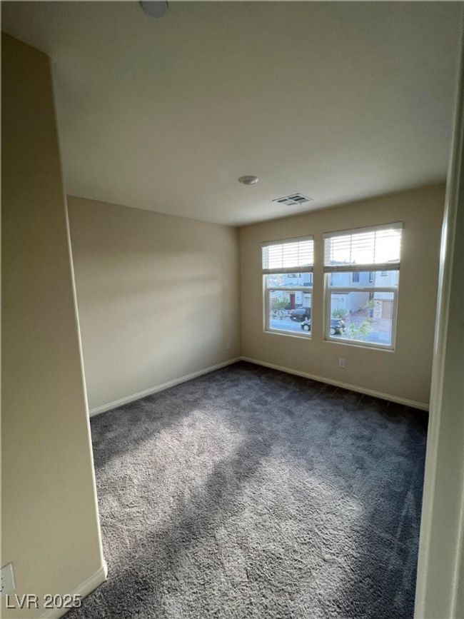 Spare room with dark colored carpet and baseboards | Image 22