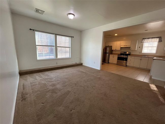 Another view of Living room with kitchen view | Image 7