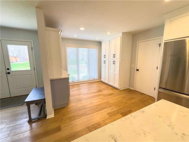 Entryway with recessed lighting and light wood-style floors | Image 11
