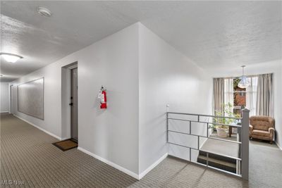 Hallway outside unit door. Landing of stairs. | Image 3