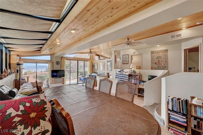 Dining space with ceiling fan and recessed lighting | Image 18